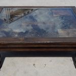 coffee table with antique carved panel