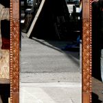 carved mirror with L-strapping