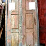 Antique doors used to make door with grilled peep