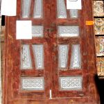 Antique cabinet door with carved panels