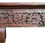 Detail of fireplace mantel with carving