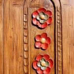 door with carved flowers detail