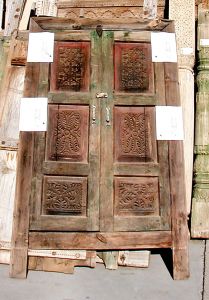 Antique cabinet door with carved panels