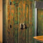 Green cabinets with crown moulding