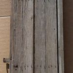 Antique planks used to make arched door