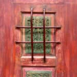 Door with carved panels grill detail