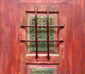 Door with carved panels grill detail