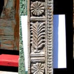 antique carved panel used to make door with sidelights