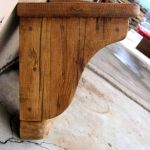 Side detail of salvaged wood corbels
