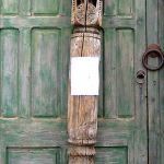 Antique carved column used to make custom newel post