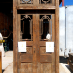 Antique doors used to make door with carved panels