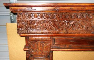 Detail of antique fireplace surround carving