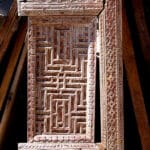 an antique panel used to make carved refrigerator panels
