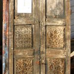 The antique cupboard doors used to make the custom front door