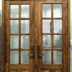 Custom French doors with transom and carved panels