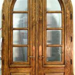 Arched French doors with operable shutters