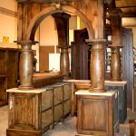 Custom home bar with arches and columns