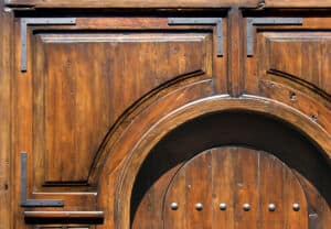 door with surround strapping and clavos detail