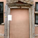 antique surround for pintle hinged door