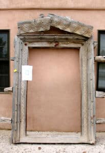 antique surround for pintle hinged door