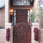 Arched entry gate and custom door