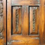 door with surround carving detail