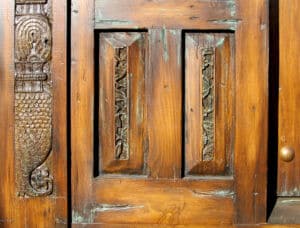 door with surround carving detail