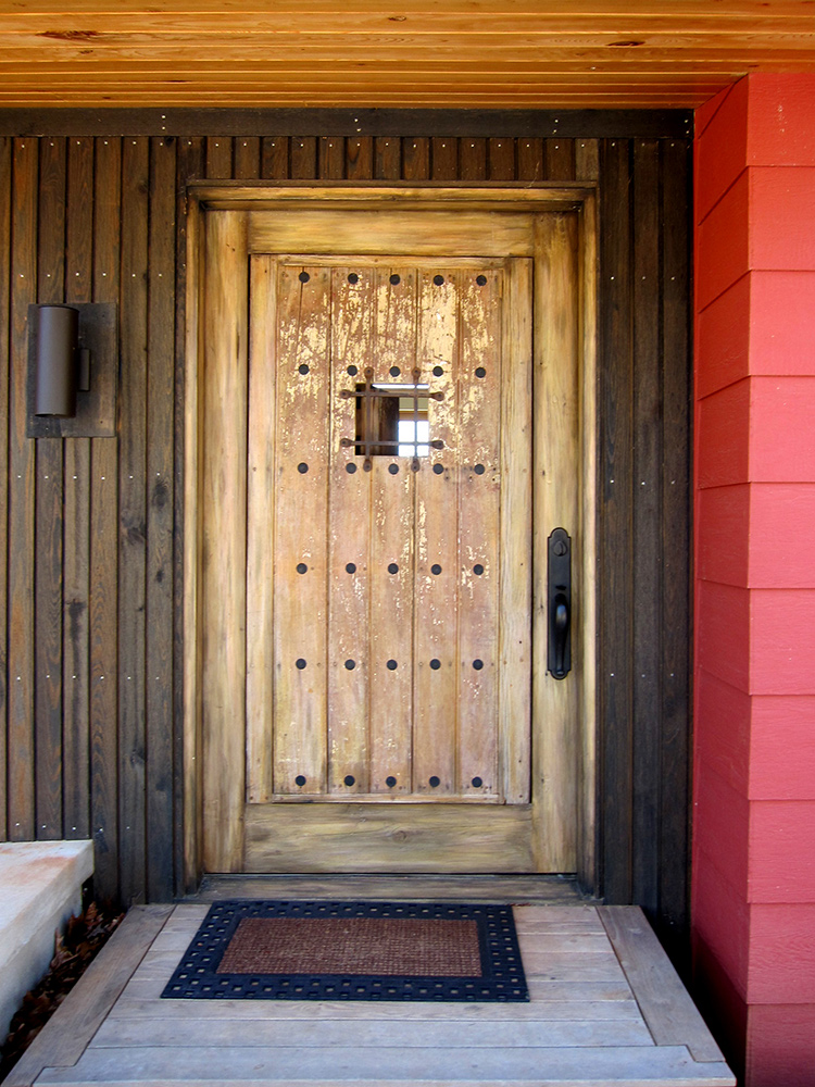 Custom door with peep shutter