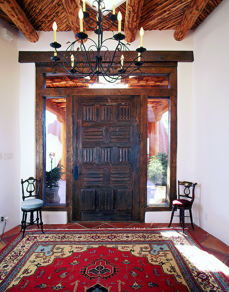 Santa Fe carved door with sidelights and transom