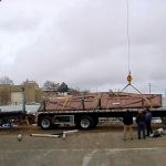 Crane loading gates onto truck