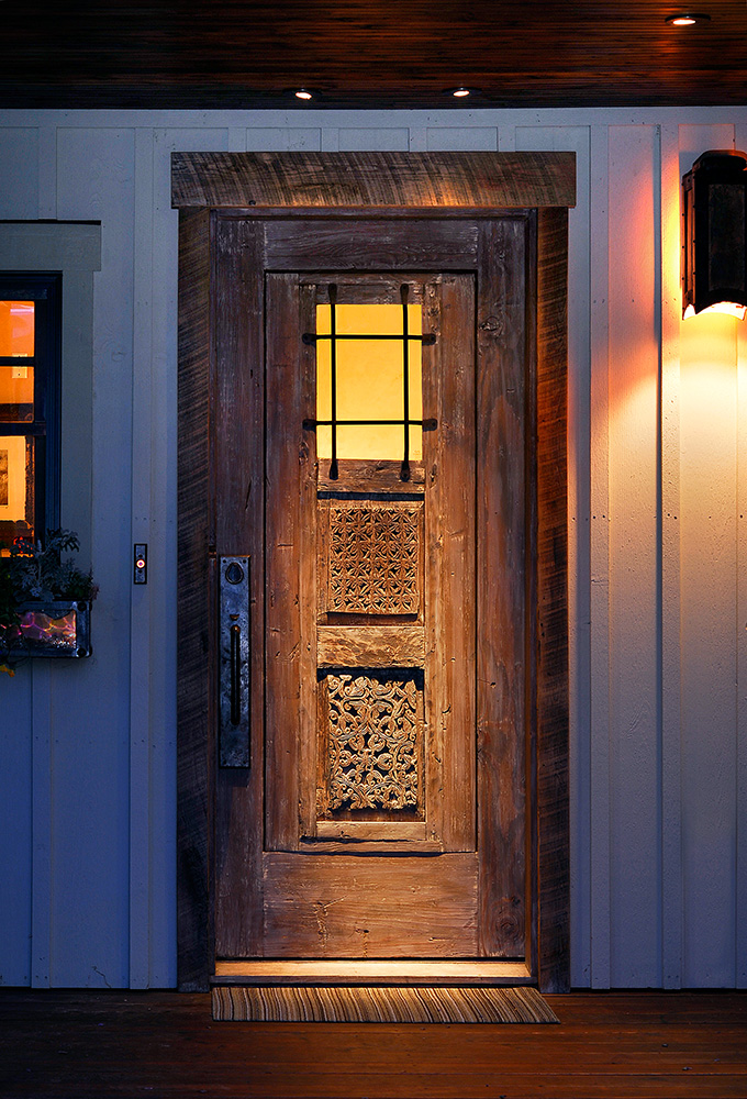 Front entry with antique carved panels