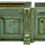 Custom kitchen cabinetry with antique carved panels
