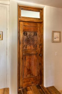 Powder room door with transom