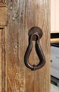 antique mesquite door with pear shaped pull handle