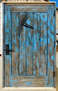 iron dragonflies on gates