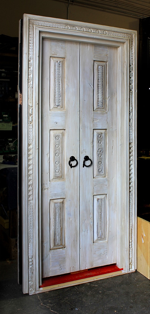 Cream doors with carved surround
