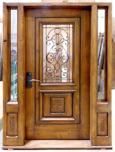 Front door with sidelights and antique carved panels