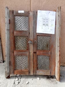 Antique cupboard doors used to make double gate