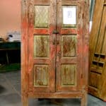 antique doors used to make front entry with shutter