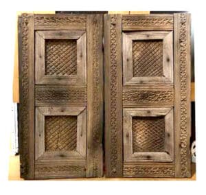 antique cabinet doors used to make cover for utility box