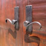 hardware detail on tin clad doors