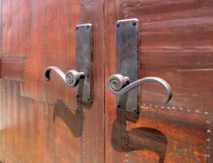 hardware detail on tin clad doors