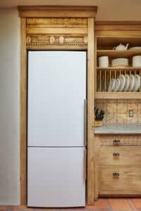 refrigerator surround with antique carved panels