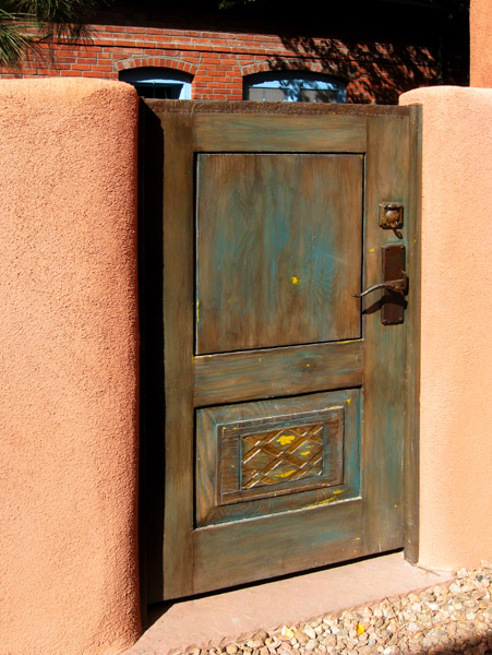 Entry gate made with antique carved panel and reclaimed lumber