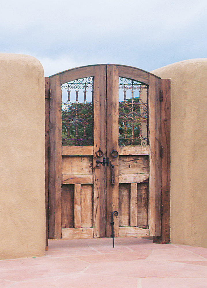 Arched entry gate with grillwork